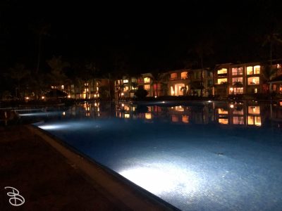 Pool and resort building at night. Pool and resort building at night.